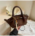 Dark brown matte suede tote bag with leather handles and decorative beaded pendant charm - Brown