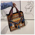 Ethnic woven tote bag featuring bohemian geometric patterns and blue fringe tassels - Dark Brown