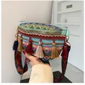 Ethnic embroidery crossbody bag with colorful tassels and woven strap in boho style - Blue