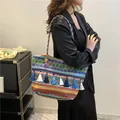 Ethnic woven tote bag with colorful bohemian patterns, blue tassels and rainbow rope straps - Blue