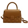 Brown quilted leather handbag with woven handle and gold hardware on white background - Brown