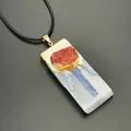 Macro detail of irregular selenite and kyanite stone pendant with gold plated edges - Orange with Leather Rope