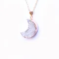 Detail of crescent moon crystal cluster pendant with rose gold plating on a fine chain - White