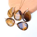 Natural tiger eye stone teardrop pendants with gold plated edges on wooden display stand - Pendant Only (Without Chain) / Tiger's Eye