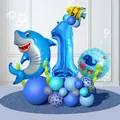 Detail of shark foil balloon column with blue number one for first birthday party - Shark Number One Ocean Style