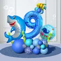 Detailed blue ocean-themed balloon column with shark, whale, and sea grass for birthday parties - Shark Number Nine Ocean Style