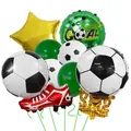Detail of football party kit featuring 3D soccer shoe and gold trophy foil balloons - Type B Trophy Red Shoes