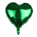 Detailed view of deep green heart-shaped foil balloon with metallic finish and valve label - Green