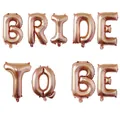 Detailed view of rose gold foil balloons spelling BRIDE TO BE for wedding party decor - Bride To Be Letter Balloons