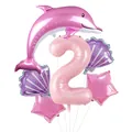 Détail d'un ensemble de ballons thème océan avec dauphin rose, coquillages et étoiles - US 2