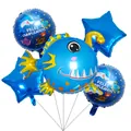 Ocean themed balloon set with blue fish star and Feliz Cumpleaños round foil balloons - Blue Anglerfish Style