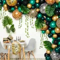 Jungle themed party set with animal print balloons, ivy vines and palm leaf decorations - Jungle Vine Style