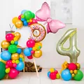 Detail of colorful number 4 balloon set with donut and bow foil balloons for kids party - Number 4