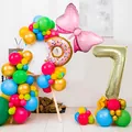 Colorful birthday balloon pillar set with donut and number 7 foil balloon decor - Number 7