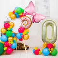 Detailed view of donut balloon with bow and large number balloon for birthday party decor - Number 0