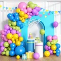 Colorful balloon arch kit with blue, yellow, and pink balloons for birthday party decor - Multicolor Balloon Arch