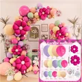Colorful daisy balloon arch kit with pink flower foil balloons for birthday party decor - Magenta Style