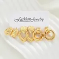 Three-pair gold earring set featuring textured hearts, ovals, and multi-layered hoops - Heart Multi-Layer Hoop Textured Gold Earrings (6593601HB)