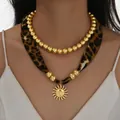 Collier double rang à perles dorées avec ruban léopard et pendentif soleil - Style Pendentif Soleil Léopard Double Couche (6626901HB)