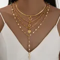 Conjunto de collares dorados con colgantes de corazón y perlas blancas en modelo - Estilo de 4 Capas Corazón Sol Perla Borla en Y Dorado (6636301HB)