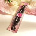 Detail of professional hair styling tool in violet retail packaging for quick updo styles - Hair Styling Four Tools Collection (Style 1)