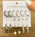 Silver-tone 9-piece earring set featuring pearls, twisted hoops, and sparkling rhinestones - Fashion Pearl Silver Hoop Set (5254425)