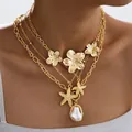 Collar de varias capas dorado con estrellas de mar, flores mate y colgante de perla - Flores Estrella de Mar Perla Dorado Cuatro Capas (6491901HB)