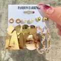 Set of six gold geometric pearl earrings including studs and hoop pendants on display - Geometric Pearl Metal Disc Gold Earring Set (51794)