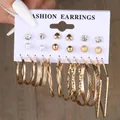 Set of 12 pairs of golden hoop and stud earrings with pearls on display card - Heart Zircon Pearl Gold Earring Collection (5792901)