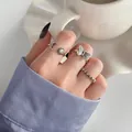 Ensemble de bagues vintage avec motifs papillon, soleil, lune et étoile fini antique - Set 4 Pièces Argent Lune Fleur Papillon (55384)