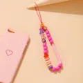 Ciondolo per cellulare boho rosa con perline in argilla pastello e fiori in acrilico - Stile Fiore d'Argilla Bohémien (5425507)