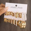 6-piece gold earring set with pearls on white display card against wood background - Polished Pearl Beaded Rect Gold Set (5811801HB)