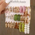 6-piece gold hoop earring set with pearls and marble resin charms on display card - Butterfly Resin Marble Pearl Gold Set (5623001)