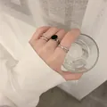 Silver stacked ring set featuring minimalist open bands and black heart accent - Simple Layered Black Stone Open Collection (54798)