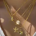 Set de collares dorados con colgantes de concha, estrella de mar y perlas - Collar / Estilo Verano Océano Concha Estrella de Mar (6502101HB)