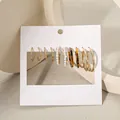 Set of 6 gold-tone hoop earrings with pearl and tortoise shell resin details on white card - Classic Hoop Loop Collection (53675)