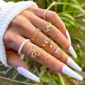 Set of 10 gold vintage leaf rings with pearls and floral designs worn on fingers - Gold Style Set (10095) / KC Gold