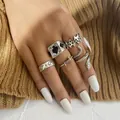Five-piece vintage silver ring set featuring spade ace and snake motifs worn on fingers - Spade Ace Flame Snake Camel Collection (54936)