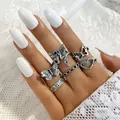 Vintage silver ring set with butterfly and fairy designs on a white lace background - Vintage Butterfly Fairy Hollow Heart Collection (55056)