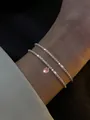 Bracciale a catena argentata scintillante con ciondolo in zircone rosa sul polso donna - Bracciale Catena Argento Zircone Rosa (5873704)
