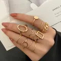 10-piece gold alloy ring set with geometric leaf and hollow patterns on fingers - Hollow Leaf Geometric Ring Set (54478) / 10 Pieces Pack / Gold