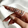 9-piece silver ring set with butterfly, pearls, and crystals on elegant white satin - 9-Piece Set (S172) / 9-Piece Set / White Gold