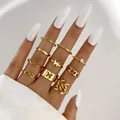 10-piece gold ring set featuring pearls, butterfly cutouts, and chain link designs for women - Gold Infinity Butterfly Artificial Pearl Style (5583701) / 10-Piece Set