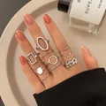 9-piece silver butterfly and pearl ring set for women showing minimalist stacking style - Geometric Leaf Stackable Ring Set (5447802) / 9 Pieces Set / Silver