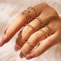 9pcs gold butterfly and pearl ring set featuring twisted and chain design on model hand - Twisted Chain Bead Multi-Piece Set (F166851) / Gold