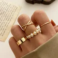 Set of four gold minimalist rings with a wide band and a white pearl accent ring - Gold Pearl Geometric Knuckle Ring 4-Piece Set (52904) / Gold