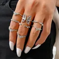 Set of 22 silver butterfly rings with rhinestones on a female model's hand - Silver Petal Butterfly Rhinestone Ring Set (5468201) / Silver