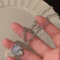 Silver-toned heart necklace with opal-style stone and glittering zircon accents - Iridescent Heart Mixed Chain Style (5636701)