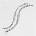 Detailed close-up of pair of silver stainless steel curb chain bracelets with engravable ID plates - 6mm Width 20CM / Steel