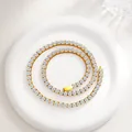 Detailed close-up of 3mm-5mm cubic zirconia tennis chain with gold plated stainless steel base - Gold Tone Wide Style (N0122G-45) / Gold